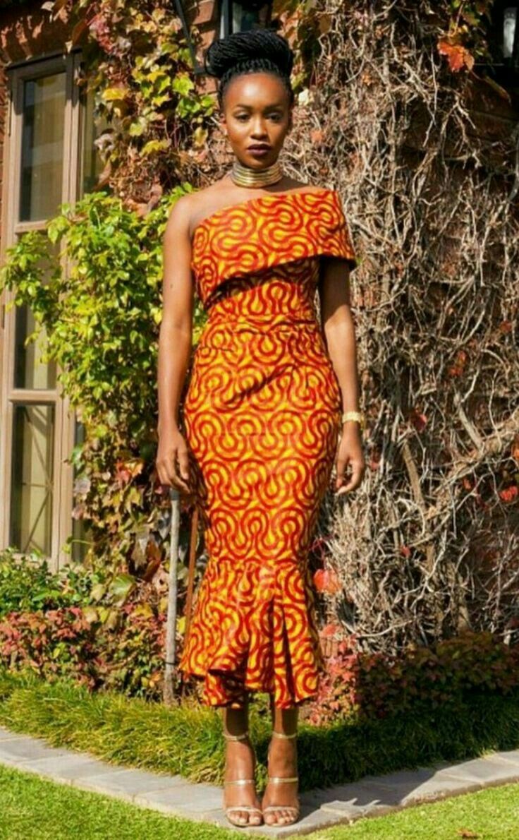 Model wearing stunning Kente-inspired dress with modern cut